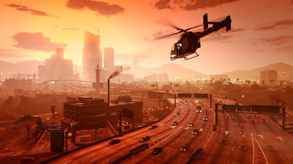 Tramonto su Los Santos in GTA V con elicottero e traffico cittadino.